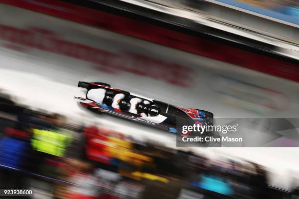 Nick Cunningham, Hakeem Abdul-Saboor, Christopher Kinney and Samuel Michener of the United States make a final run during the 4-man Boblseigh Heats...