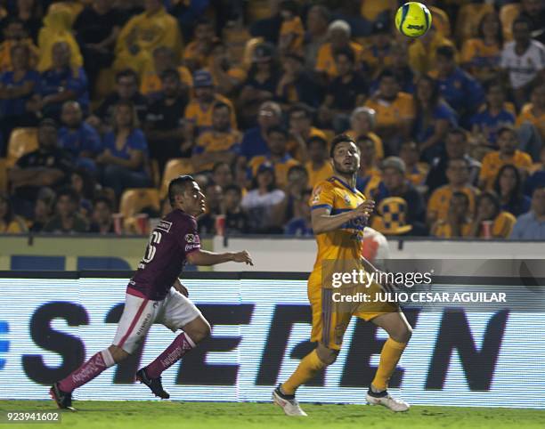 Andre Pierre Gignac of Tigres vies for the ball with Aldo Rocha of Morelia during their Mexican Clausura 2018 tournament football match at the...