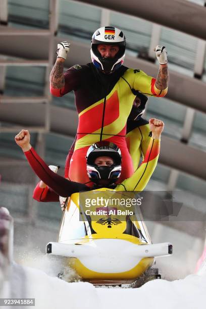 Nico Walther, Kevin Kuske, Alexander Roediger and Eric Franke of Germany celebrate after their run during the 4-man Boblseigh Heats on day sixteen of...