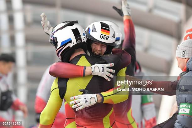 Germany's Francesco Friedrich team celebrates the gold after the 4-man bobsleigh heat 4 final run during the Pyeongchang 2018 Winter Olympic Games,...