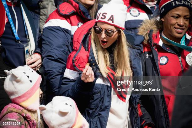 Child is given a chocolate to Ivanka Trump as she attends the 4-man Boblseigh on day sixteen of the PyeongChang 2018 Winter Olympic Games at Olympic...