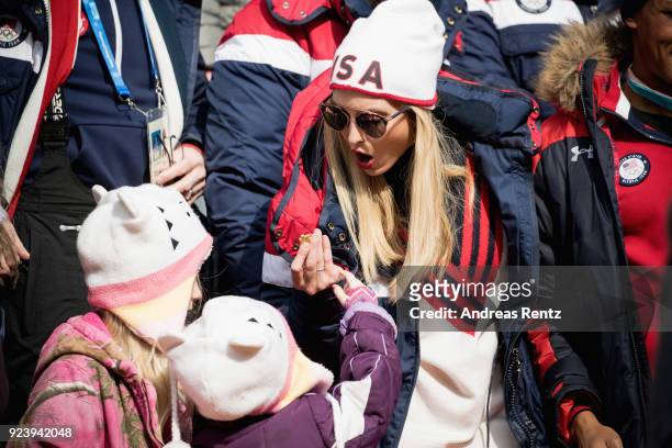 Child is given a chocolate to Ivanka Trump as she attends the 4-man Boblseigh on day sixteen of the PyeongChang 2018 Winter Olympic Games at Olympic...