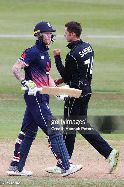 Ben Stokes of England walks off as Mitchell Santner of the Black Caps celebrates his wicket during game one in the One Day International series...