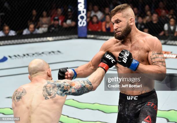 Jeremy Stephens punches Josh Emmett in their featherweight bout during the UFC Fight Night event at Amway Center on February 24, 2018 in Orlando,...