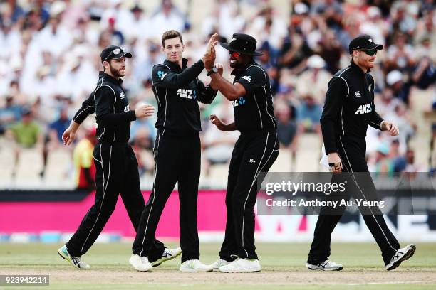 Mitchell Santner of New Zealand celebrates with teammates for the wicket of Ben Stokes of England during game one in the One Day International series...