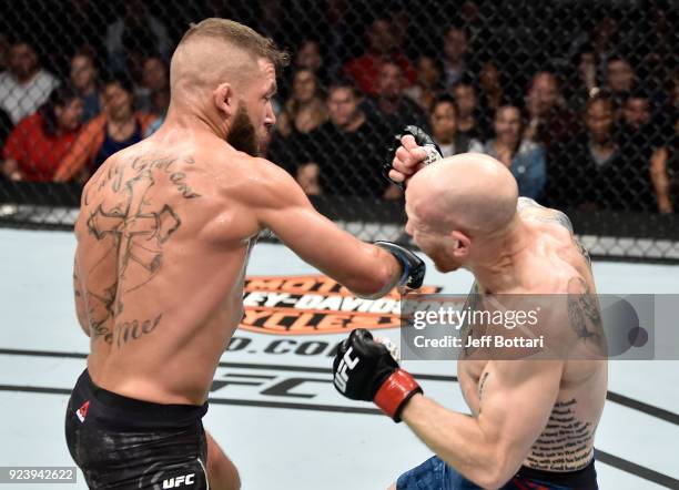 Jeremy Stephens punches Josh Emmett in their featherweight bout during the UFC Fight Night event at Amway Center on February 24, 2018 in Orlando,...