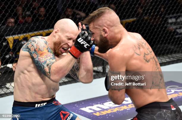 Jeremy Stephens punches Josh Emmett in their featherweight bout during the UFC Fight Night event at Amway Center on February 24, 2018 in Orlando,...