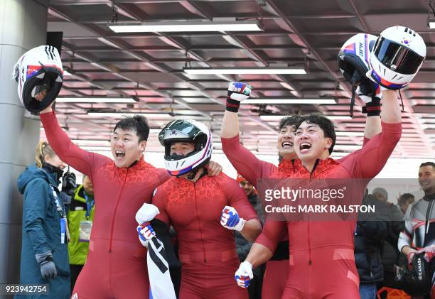 South Korea's Seo Youngwoo , Won Yunjong, Jun Junglin, and Kim Donghyun celebrate after the 4-man bobsleigh heat 4 final run during the Pyeongchang...