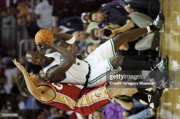 Kevin Garnett of the Boston Celtics drives the ball against Anderson Varejao of the Cleveland Cavaliers during the season opener at Quicken Loans...