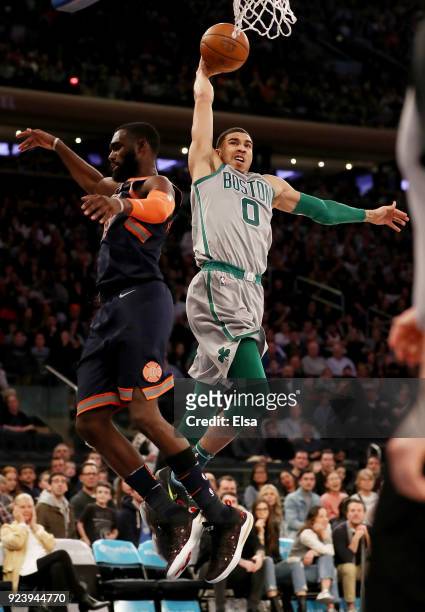 Jayson Tatum of the Boston Celtics heads for the net as Tim Hardaway Jr. #3 of the New York Knicks defends at Madison Square Garden on February...