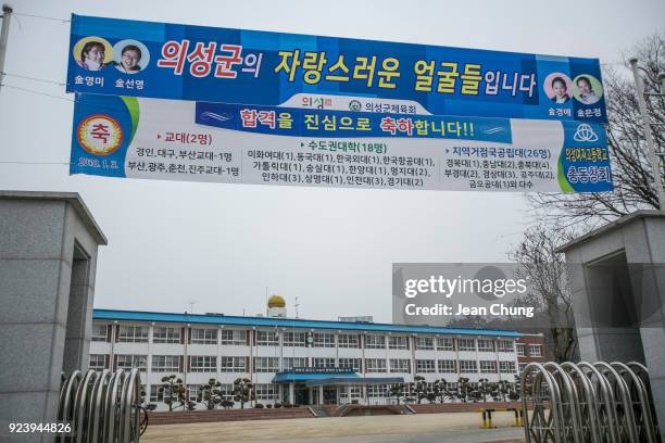 Banners are displayed at the gate of Uiseong Girls' High School where the players have graduated on February 25, 2018 in Uiseong-gun, South Korea....