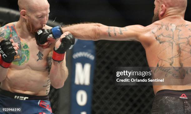 Jeremy Stephens, right, lands a crushing blow to the chin of Josh Emmett during UFC Fight Night at the Amway Center in Orlando, Fla., on Saturday,...