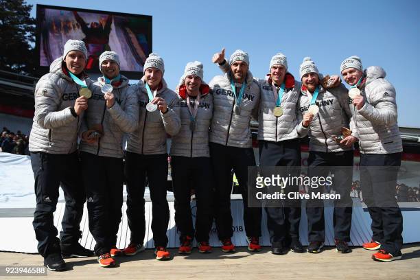Gold medalists Francesco Friedrich, Candy Bauer, Martin Grothkopp and Thorsten Margis of Germany and joint silver medalists Nico Walther, Kevin...
