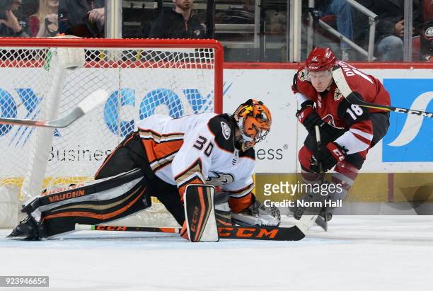 Goalie Ryan Miller of the Anaheim Ducks makes a save on the shot attempt by Christian Dvorak of the Arizona Coyotes during the third period at Gila...
