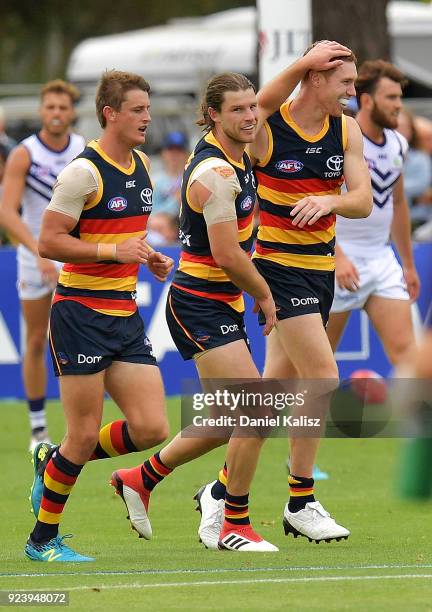 Bryce Gibbs of the Crows celebrates with Tom Lynch of the Crows after kicking a goal during the JLT Community Series AFL match between the Adelaide...