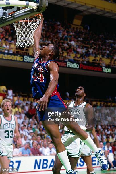 Rick Mahorn of the Detroit Pistons dunks against the Boston Celtics during a game played in 1987 at the Boston Garden in Boston, Massachusetts. NOTE...