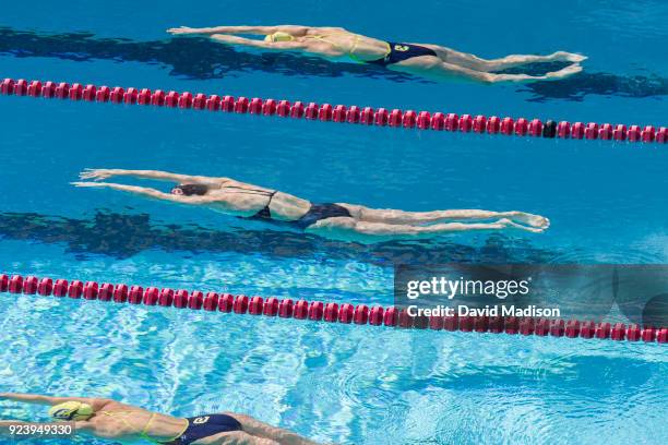 Katie Ledecky of the Stanford Cardinal glides underwater at the start of the 500 yard Freestyle event of an NCAA PAC-12 Women's swim meet against the...