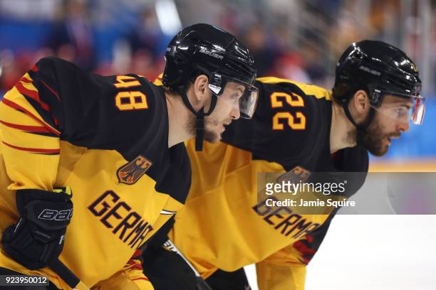 Frank Hordler and Matthias Plachta of Germany look on in the first period against Olympic Athletes from Russia during the Men's Gold Medal Game on...