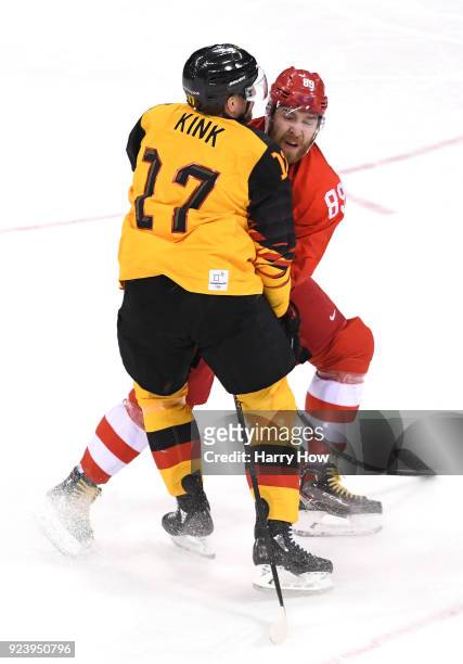 Marcus Kink of Germany collides with Nikita Nesterov of Olympic Athlete from Russia in the first period during the Men's Gold Medal Game on day...