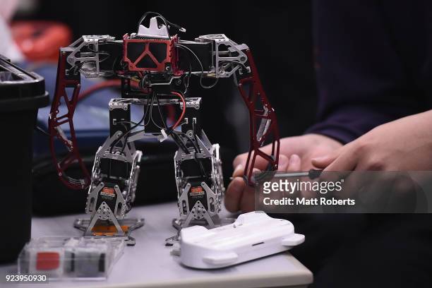 Technician works on their robots during the 32nd ROBO-ONE tournament on February 25, 2018 in Tokyo, Japan. According to the organizer, the ROBO-ONE,...