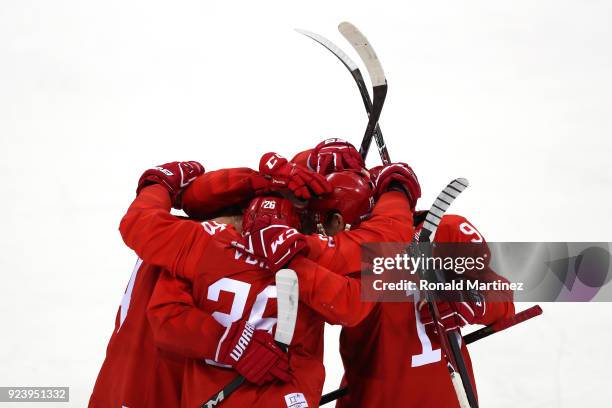 Vyacheslav Voinov of Olympic Athlete from Russia celebrates with teammates after a goal in the first period against Germany during the Men's Gold...