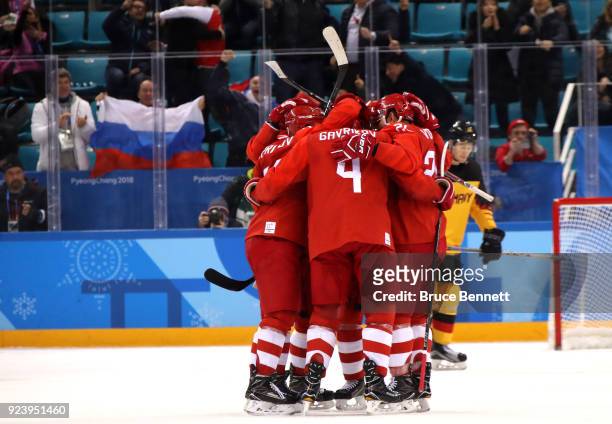 Vyacheslav Voinov of Olympic Athlete from Russia celebrates with teammates after a goal in the first period against Germany during the Men's Gold...