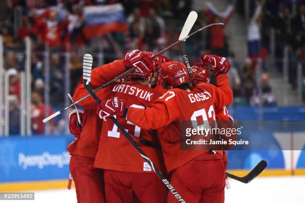 Vyacheslav Voinov of Olympic Athlete from Russia celebrates with teammates after a goal in the first period against Germany during the Men's Gold...