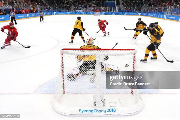 Vyacheslav Voinov of Olympic Athlete from Russia shoots and scores a goal in the first period against Danny Aus Den Birken of Germany during the...