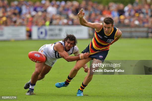 Brady Grey of the Dockers tackles Paul Seedsman of the Crows during the JLT Community Series AFL match between the Adelaide Crows and the Fremantle...