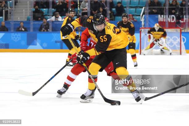 Felix Schutz of Germany controls the puck against Olympic Athletes from Russia in the first period during the Men's Gold Medal Game on day sixteen of...
