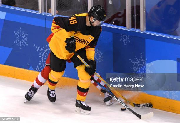 Frank Hordler of Germany competes for the puck with Kirill Kaprizov of Olympic Athlete from Russia in the second period during the Men's Gold Medal...
