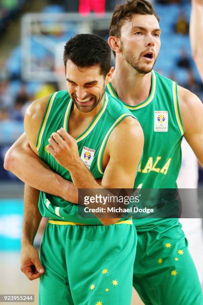 Kevin Lisch of the Boomers, held up by Angus Brandt, reacts after copping a knock to the head by Long Mao Hu of Chinese Taipei during the FIBA World...