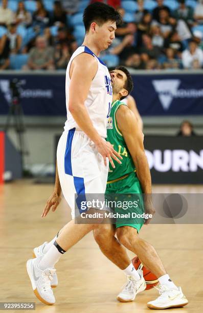 Kevin Lisch of the Boomers cops a knock to the head by Long Mao Hu of Chinese Taipei during the FIBA World Cup Qualifying match between the...