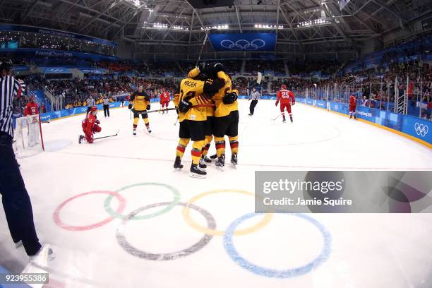 Felix Schutz of Germany celebrates with teammates after scoring a goal in the second period against Olympic Athletes from Russia during the Men's...