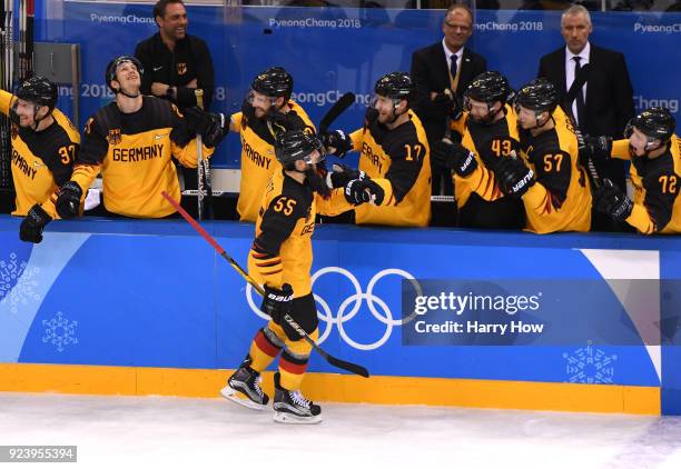 Felix Schutz of Germany celebrates with teammates after scoring a goal in the second period against Olympic Athletes from Russia during the Men's...