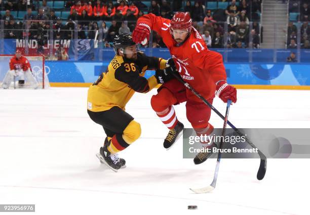 Yannic Seidenberg of Germany competes for the puck with Ilya Kovalchuk of Olympic Athlete from Russia in the second period during the Men's Gold...