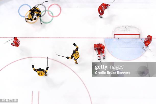 Felix Schutz of Germany celebrates with Brooks Macek, Patrick Hager and Moritz Muller of Germany after scoring a goal in the second period against...