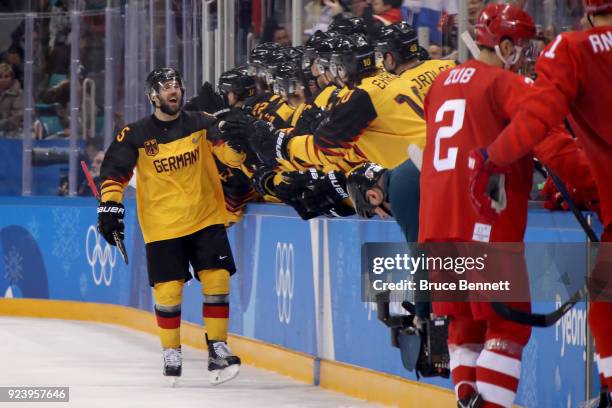 Felix Schutz of Germany celebrates with teammates after scoring a goal in the second period against Olympic Athletes from Russia during the Men's...