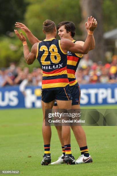 Cam Ellis-Yolmen celebrates with Darcy Fogarty of the Crows during the JLT Community Series AFL match between the Adelaide Crows and the Fremantle...