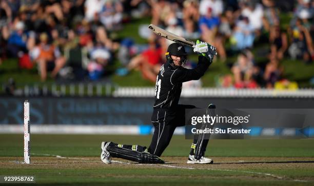 New Zealand batsman Martin Guptill drives during the 1st ODI between New Zealand and England at Seddon Park on February 25, 2018 in Hamilton, New...