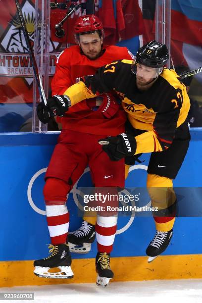 Marcus Kink of Germany collides with Yegor Yakovlev of Olympic Athlete from Russia in the third period during the Men's Gold Medal Game on day...