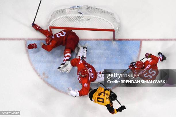 Russia's Sergei Kalinin crashes into the net in the men's gold medal ice hockey match between the Olympic Athletes from Russia and Germany during the...