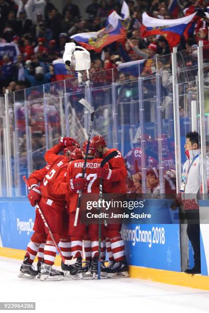 Nikita Gusev of Olympic Athlete from Russia celebrates with teammates after scoring the tying goal in the third period against Germany during the...