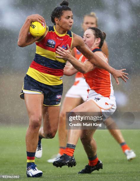 Ruth Wallace of the Crows is challenged by Jodie Hicks of the Giants during the round four AFLW match between the Greater Western Sydney Giants and...