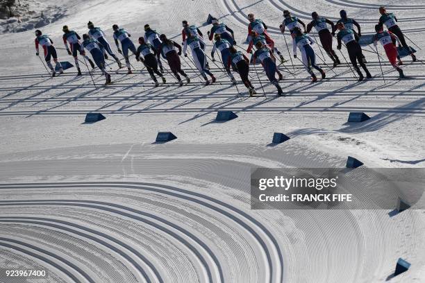 Athletes compete during the women's 30km cross country mass start classic at the Alpensia cross country ski centre during the Pyeongchang 2018 Winter...