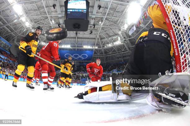 Danny Aus Den Birken of Germany allows a goal by Nikita Gusev of Olympic Athlete from Russia in the third period during the Men's Gold Medal Game on...