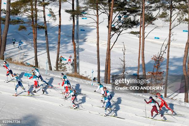 Athletes compete during the women's 30km cross country mass start classic at the Alpensia cross country ski centre during the Pyeongchang 2018 Winter...