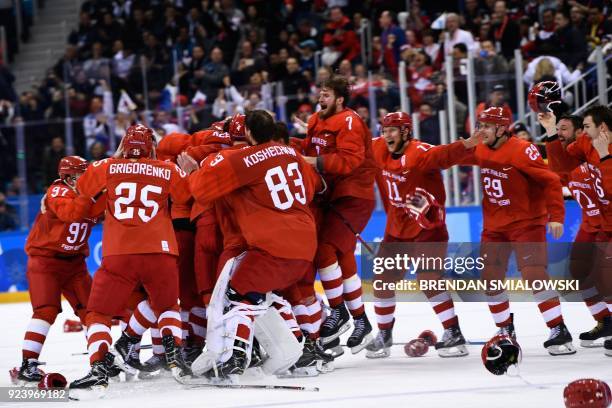 The Olympic Athletes from Russia celebrate winning the men's gold medal ice hockey match between the Olympic Athletes from Russia and Germany during...