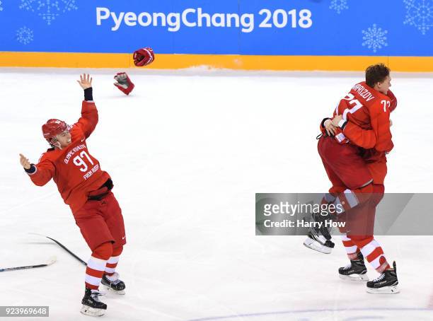 Gold medal winner Kirill Kaprizov of Olympic Athlete from Russia celebrates with Vyacheslav Voinov and Nikita Gusev after scoring a goal in overtime...