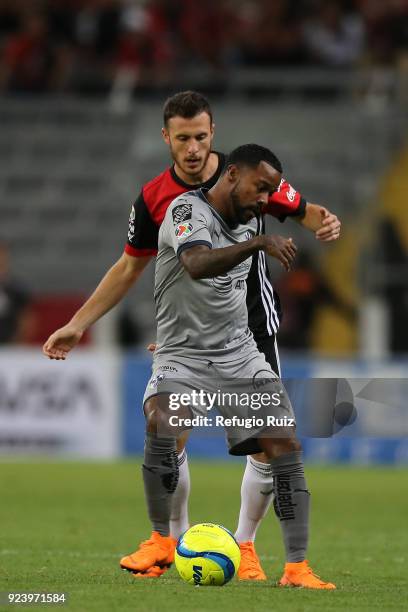 Angelo Henriquez of Atlas fights for the ball with Dorlan Pabon of Monterrey during the 9th round match between Atlas and Monterrey as part of the...